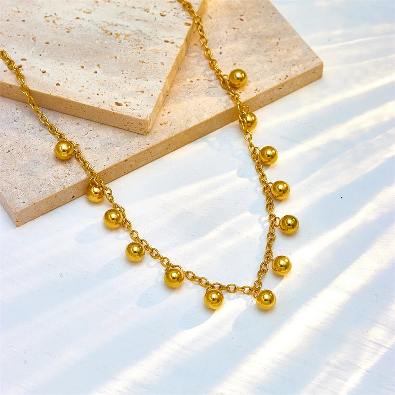 COLLAR CON BOLITAS DORADAS