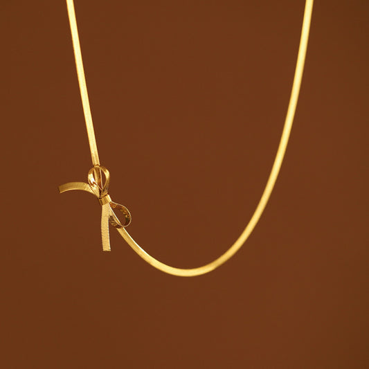 COLLAR C/MOÑO DORADO CHICO