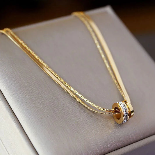 COLLAR DOBLE DORADO C/RUEDITAS